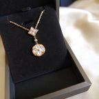 [Marin]COLLIER ÉTOILE ET SOLEIL EN NACRE BLANCHE À 2 MOTIFS EN OR ROSE