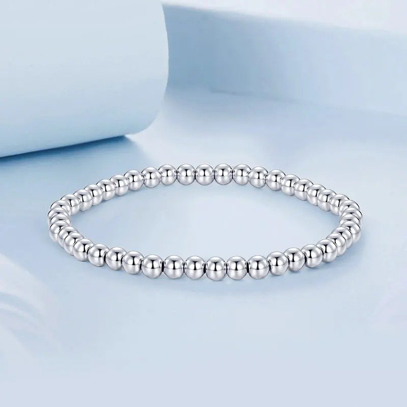 Bracelet boule de perles élastique or blanc