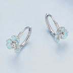 Boucles d'oreilles créoles fleurs iris émaillées bleues